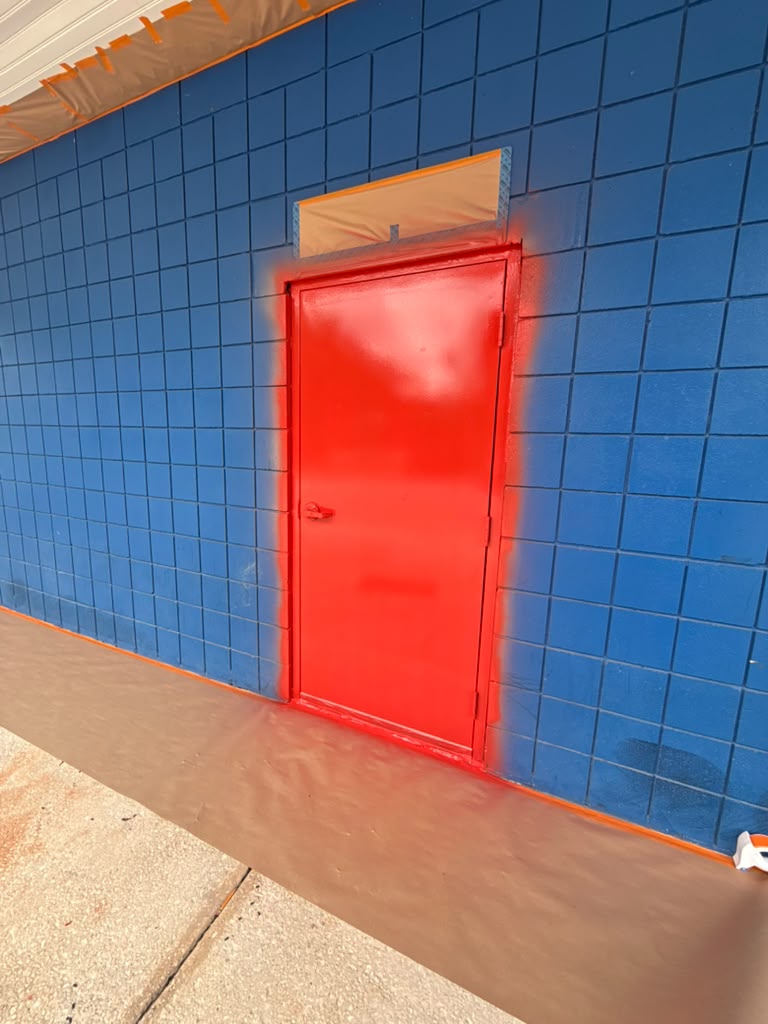 Freshly painted red commercial door