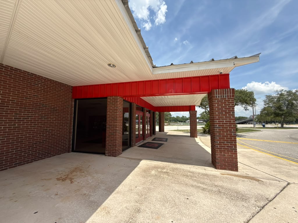 All Saints Academy breezeway with red trim
