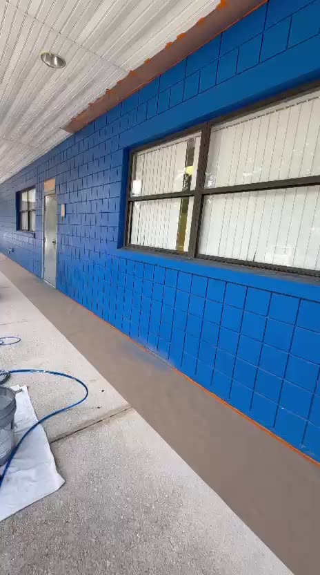 Gunners Painting crew painting a commercial exterior