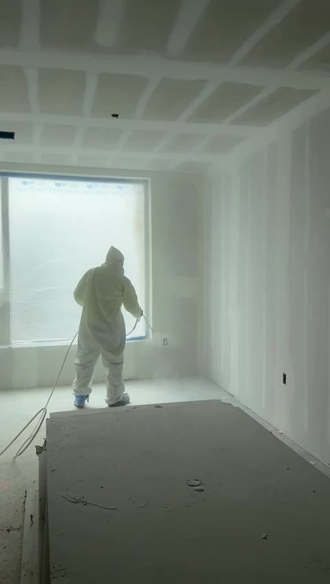 Gunners Painting crew spray-finishing a commercial interior