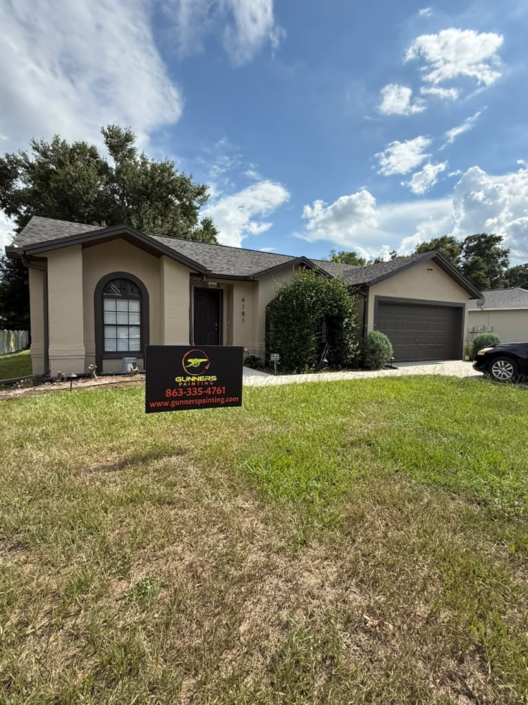Residential exterior repaint, tan finish with dark trim
